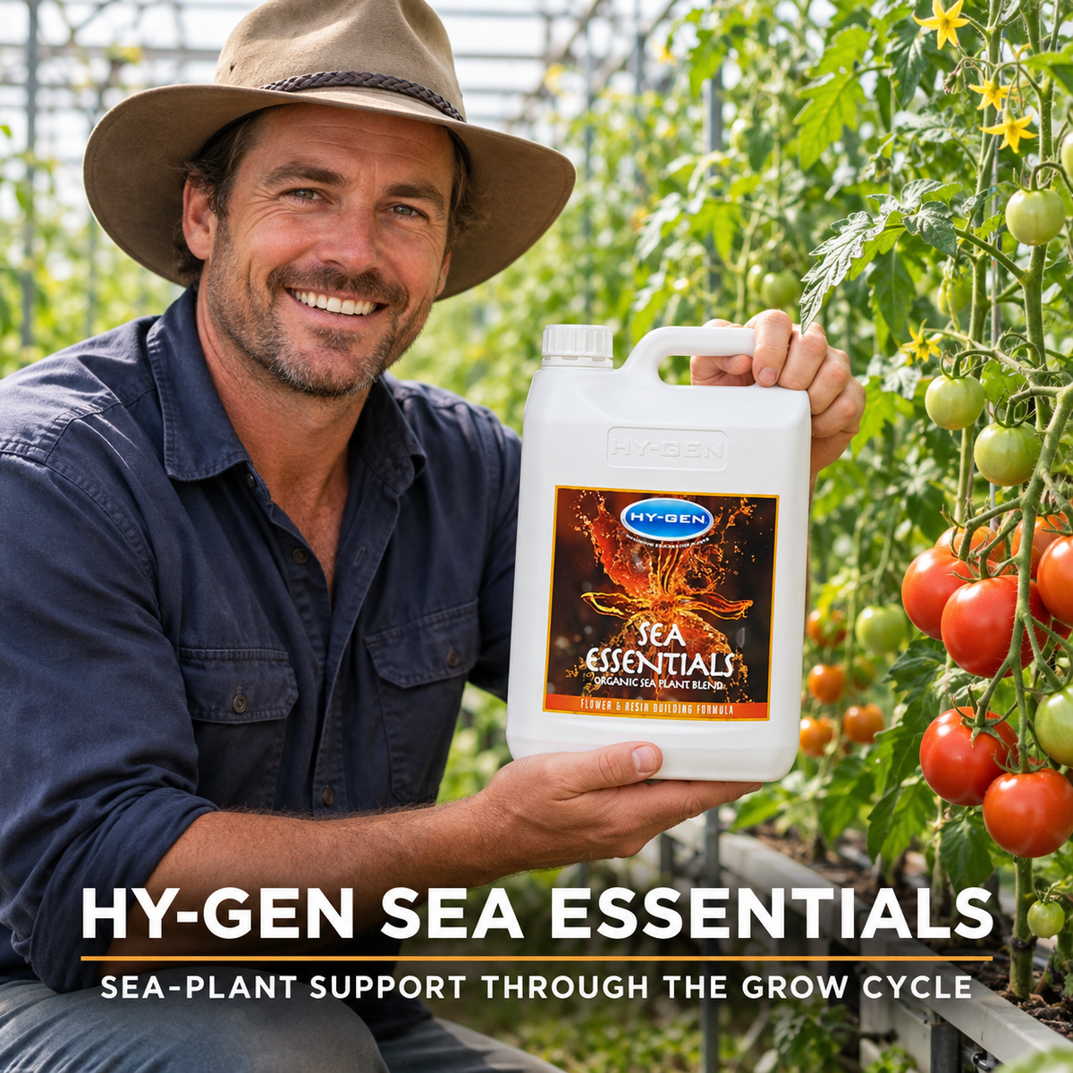 Adult Australian tomato greenhouse grower presenting a closed white 5L jug of HY-GEN SEA ESSENTIALS.